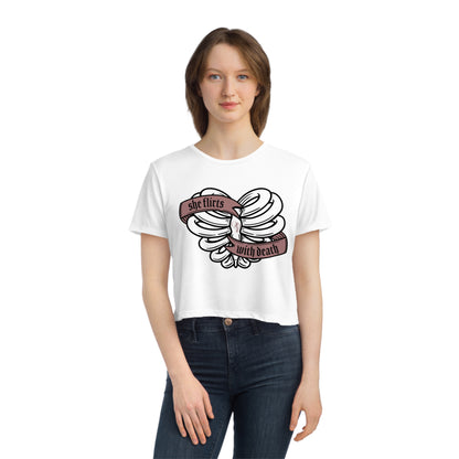 She Flirts with Death - Women's Flowy Cropped Tee